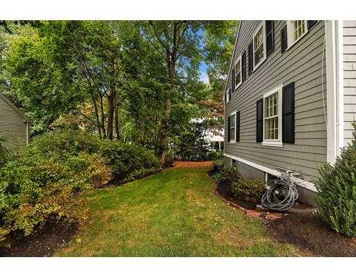 12 Cleveland Road Wellesley, MA 02481 - Photo 23 of 25 a view of a backyard with table and chairs and potted plants