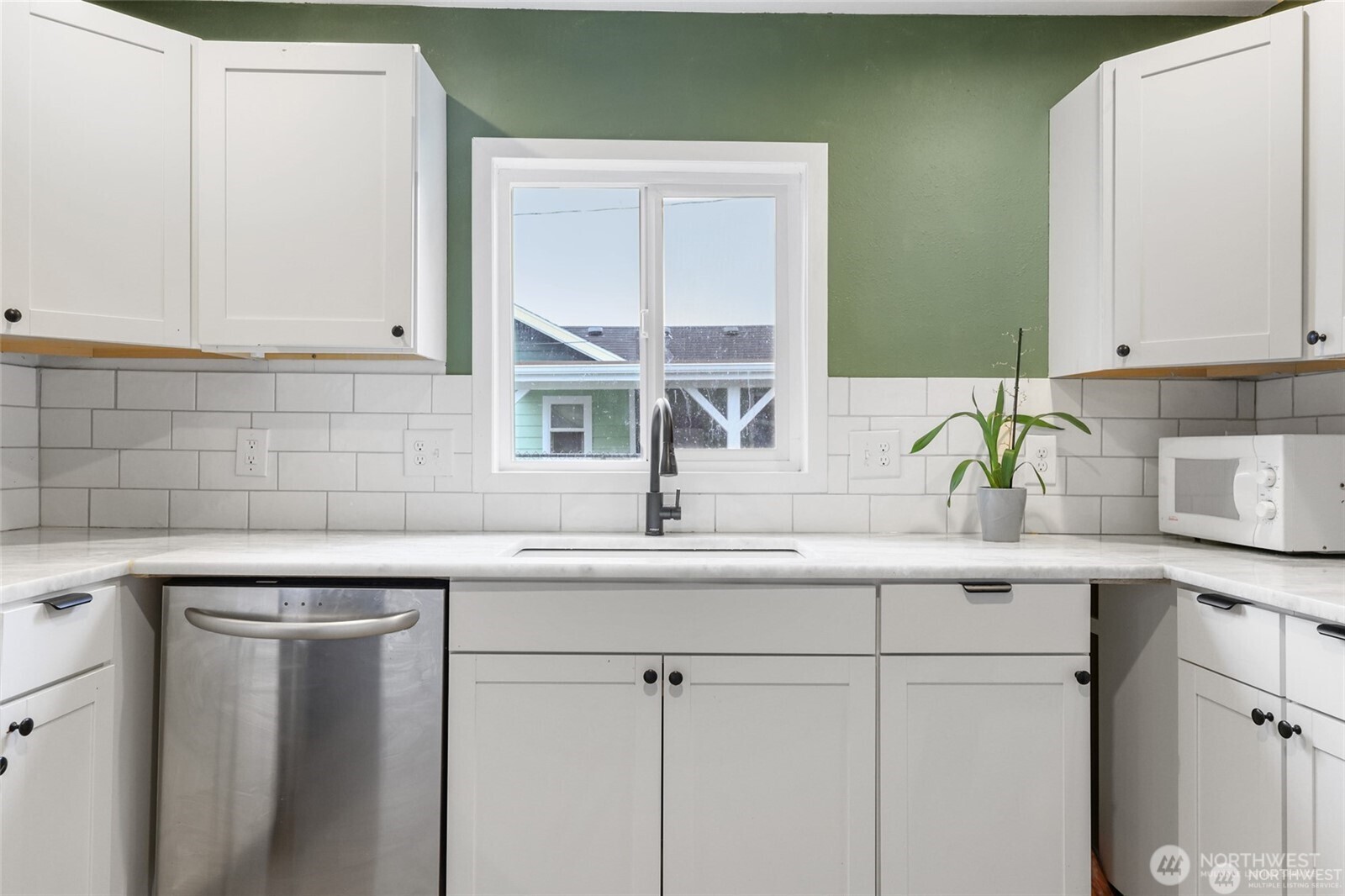 325 East Perry Street Aberdeen, WA 98520 - Photo 13 of 27 a kitchen with a sink and cabinets