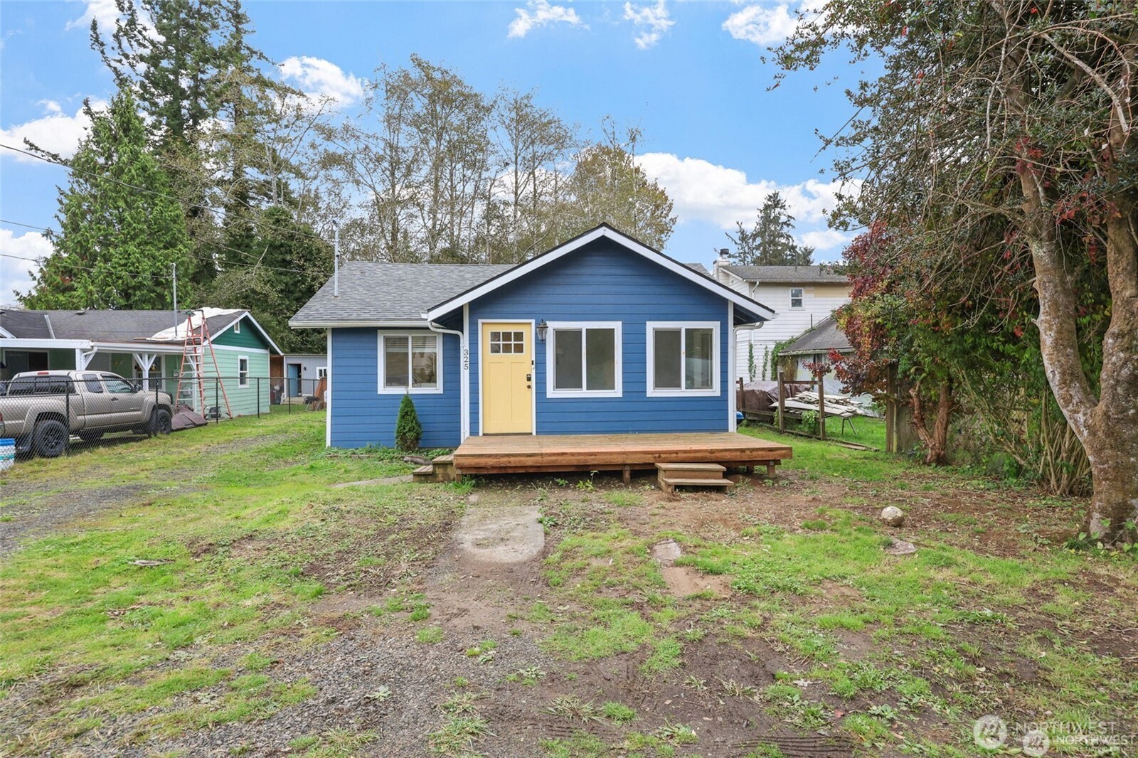 325 East Perry Street Aberdeen, WA 98520 - Photo 2 of 27 a view of a house with a yard and trees