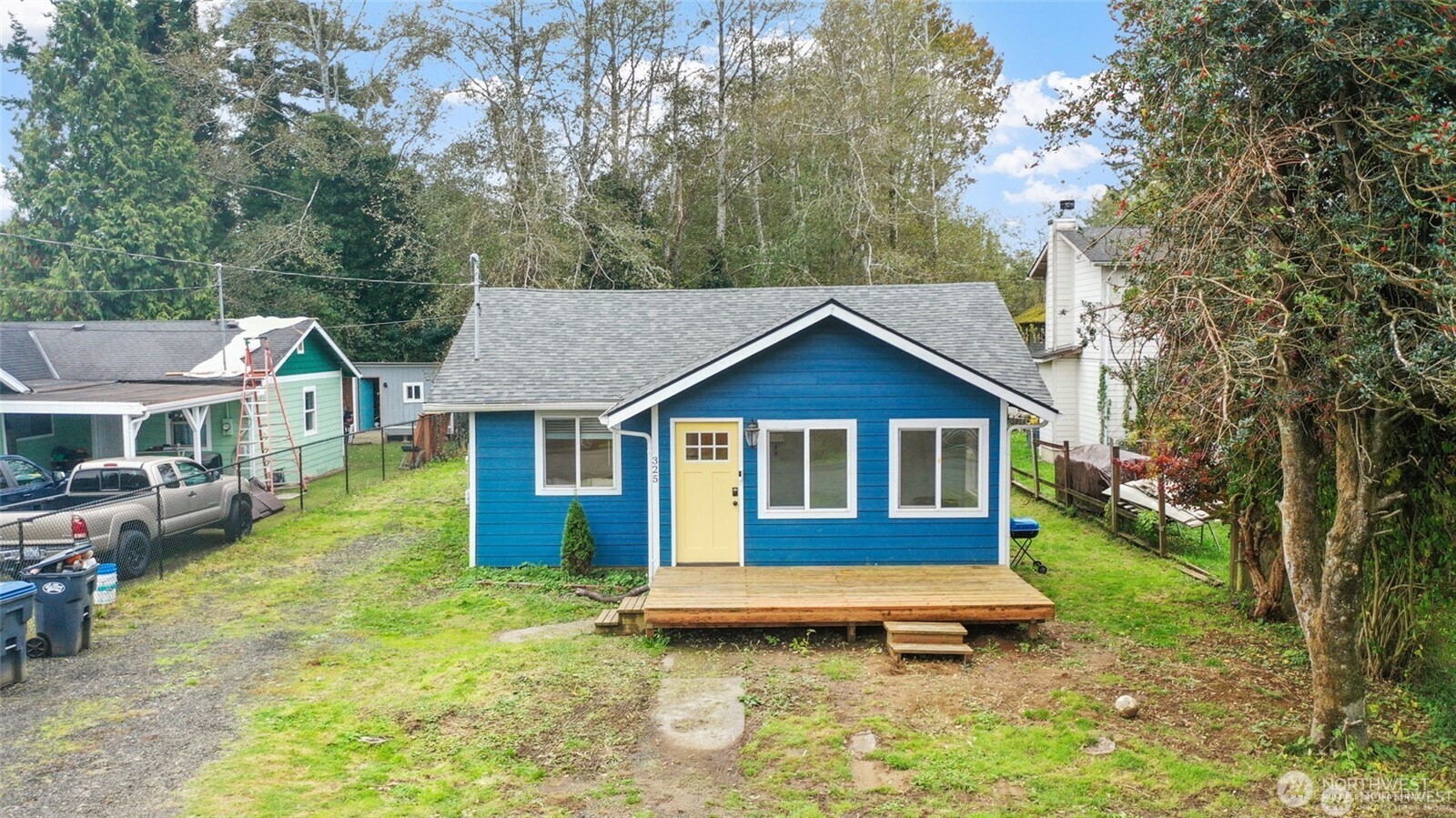325 East Perry Street Aberdeen, WA 98520 - Photo 23 of 27 a view of a house with a yard patio and trees