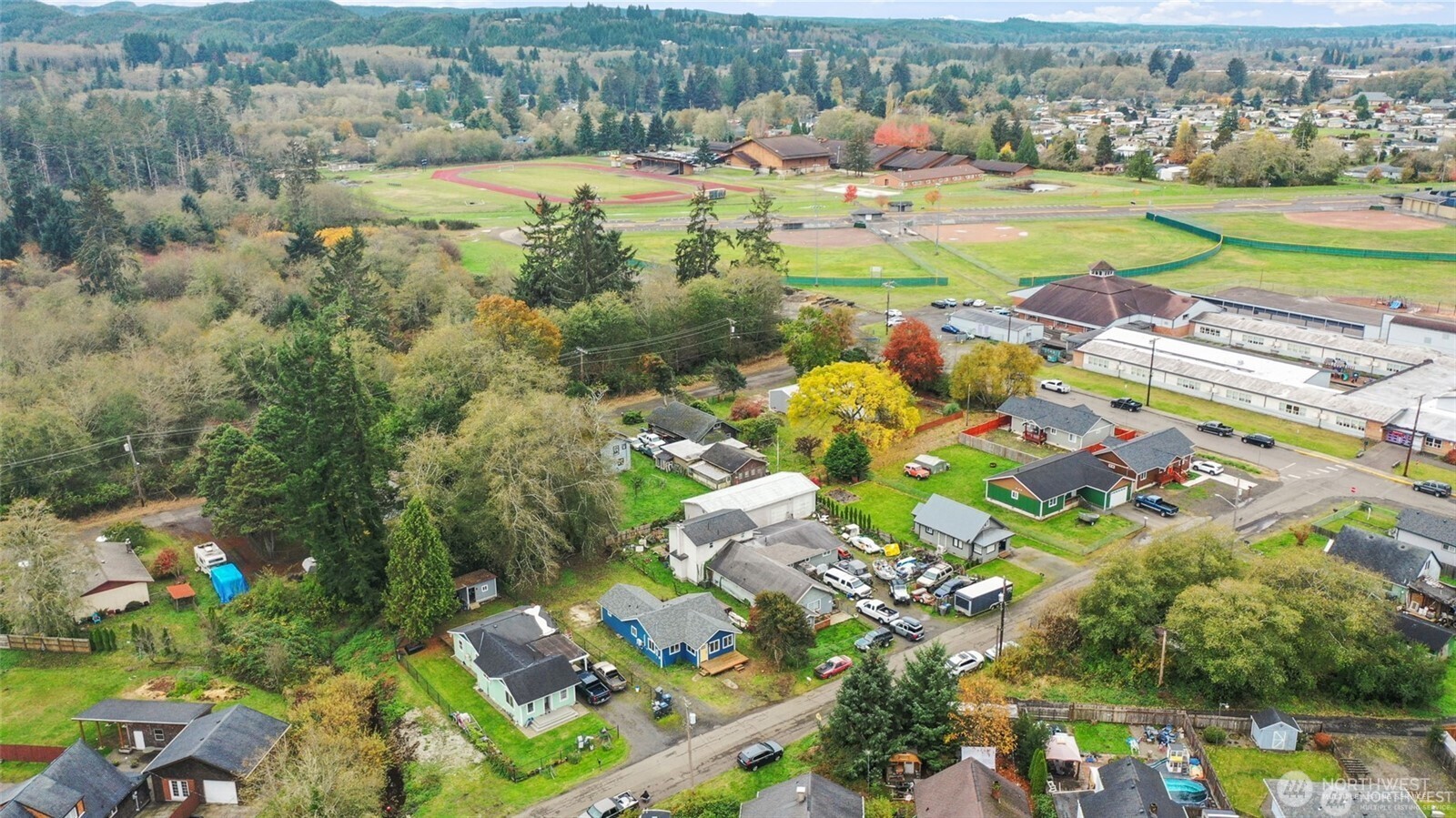 325 East Perry Street Aberdeen, WA 98520 - Photo 27 of 27 an aerial view of a houses with a lake view