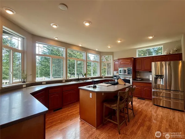 a view of a dining room with furniture window and wooden floor