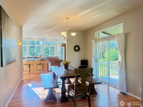 a living room with dining table and chairs