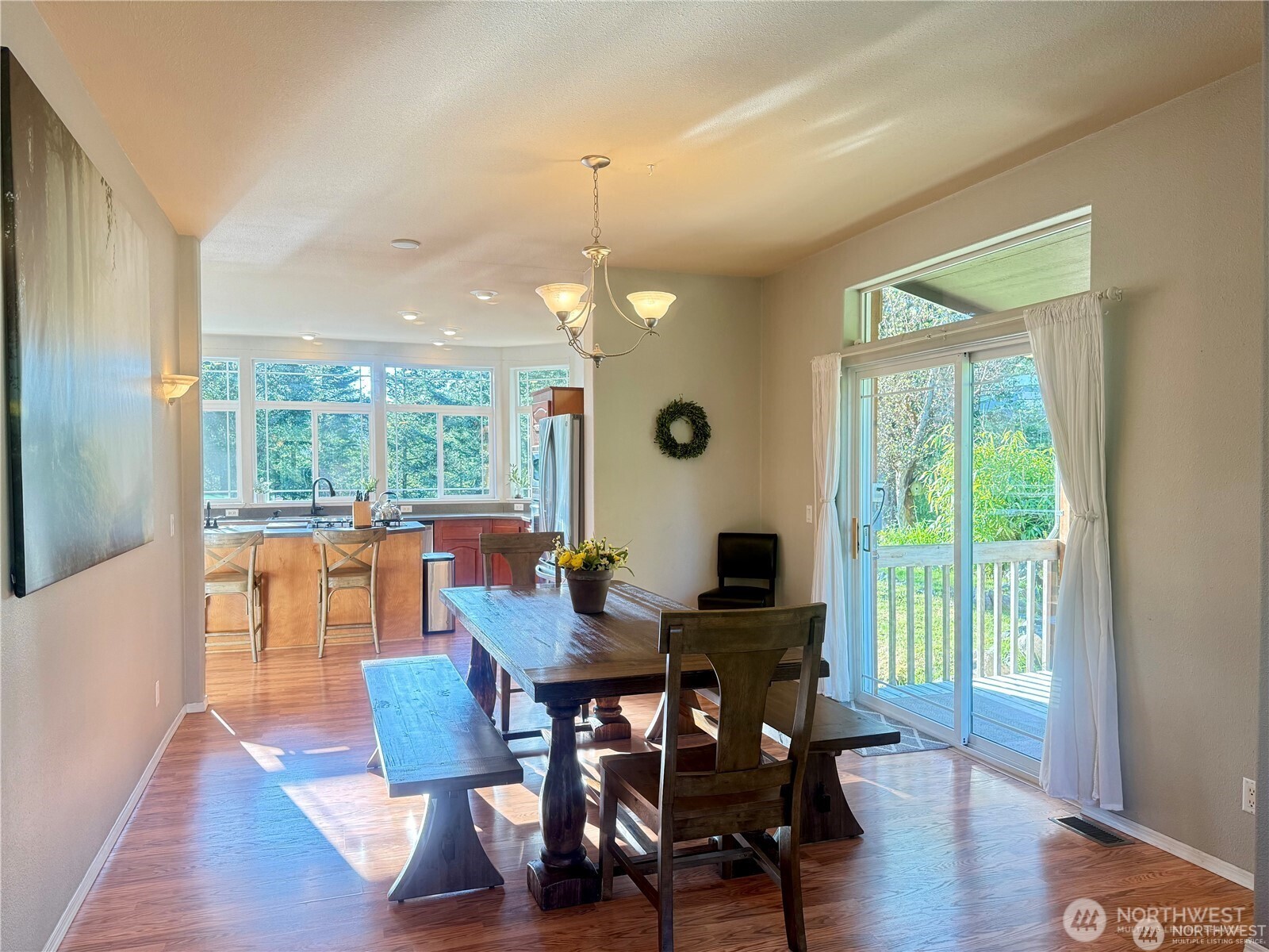 168 Jackson Road Orcas Island, WA 98245 - Photo 18 of 40 a view of a dining room with furniture window and wooden floor