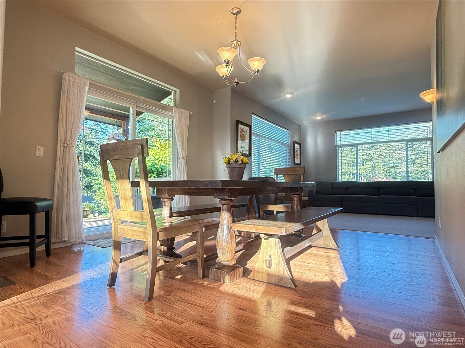 168 Jackson Road Orcas Island, WA 98245 - Photo 19 of 40 a view of a dining room with furniture a chandelier and wooden floor