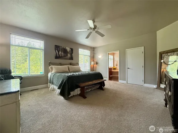 a bed room with a bed and a television