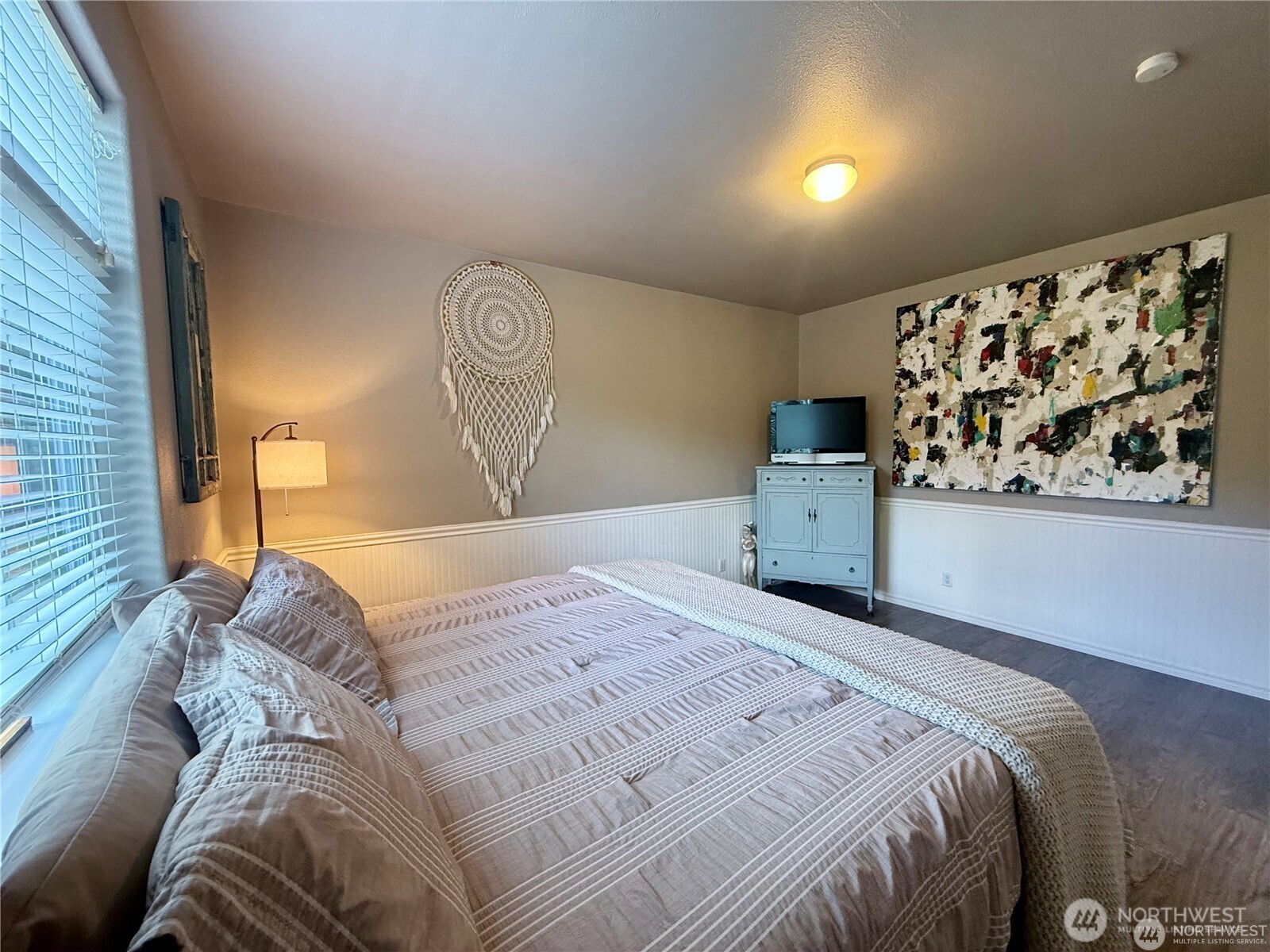 168 Jackson Road Orcas Island, WA 98245 - Photo 37 of 40 a bed sitting in a bedroom next to a window with cabinet