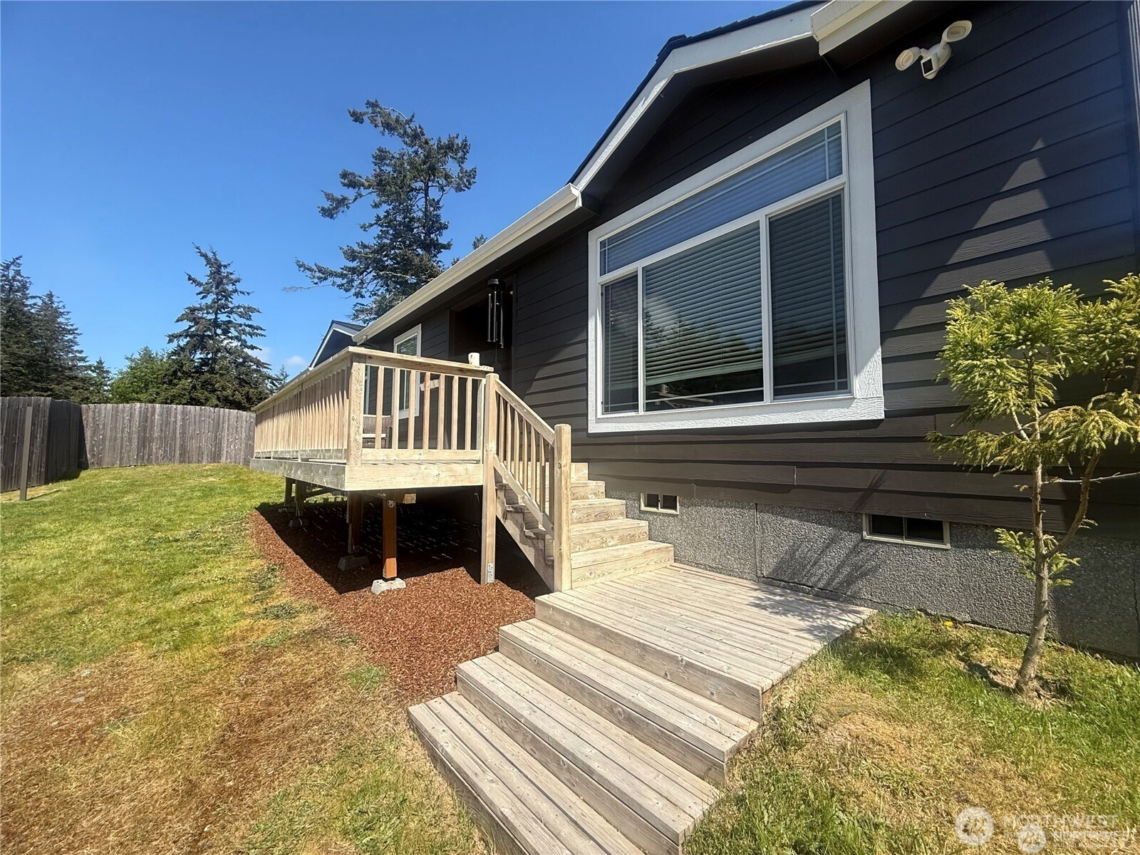 168 Jackson Road Orcas Island, WA 98245 - Photo 6 of 40 a front view of a house with a yard