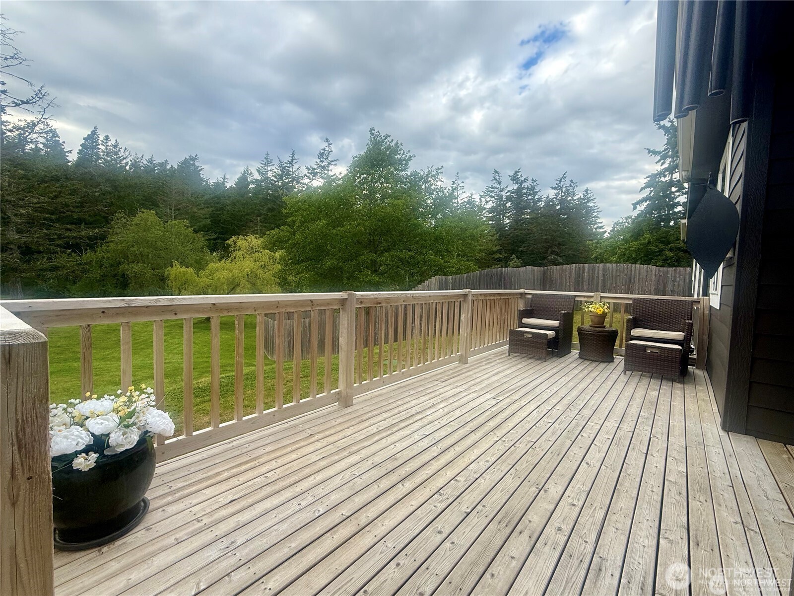 168 Jackson Road Orcas Island, WA 98245 - Photo 7 of 40 a balcony with wooden floor table and chairs