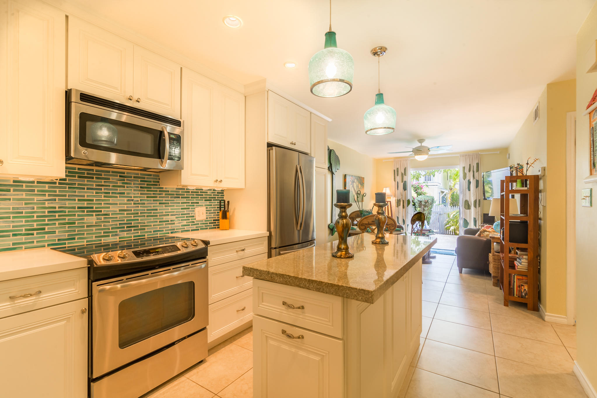 102 Southard Street, Unit 2 Key West, FL 33040 - Photo 1 of 25 a kitchen with a stove a sink and a microwave