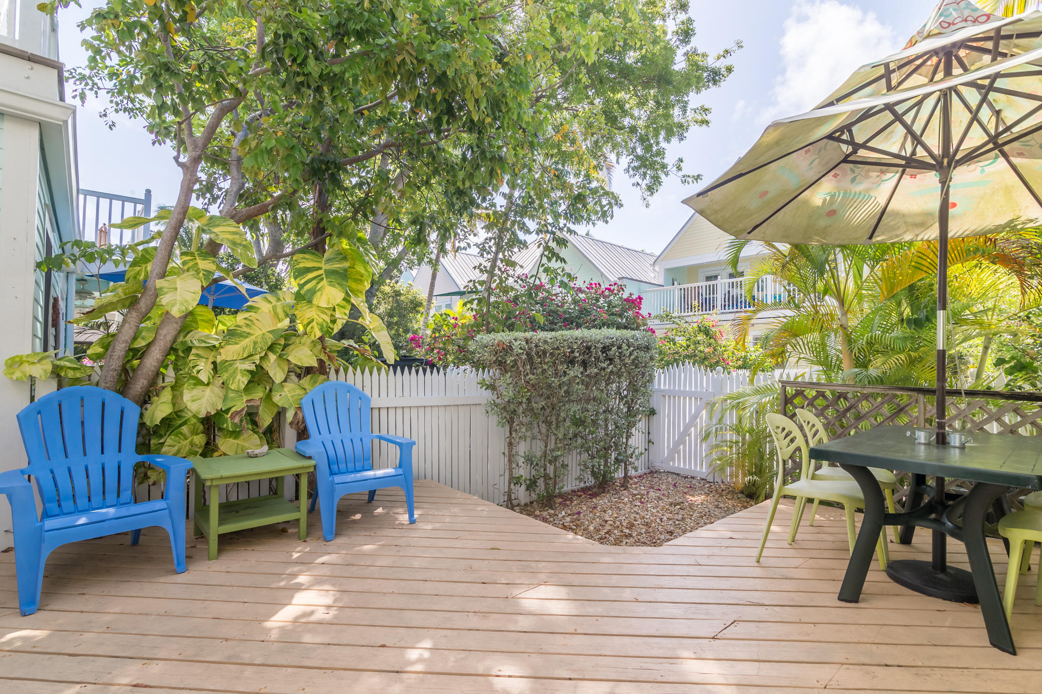 102 Southard Street, Unit 2 Key West, FL 33040 - Photo 17 of 25 a view of a chairs and table on the wooden floor