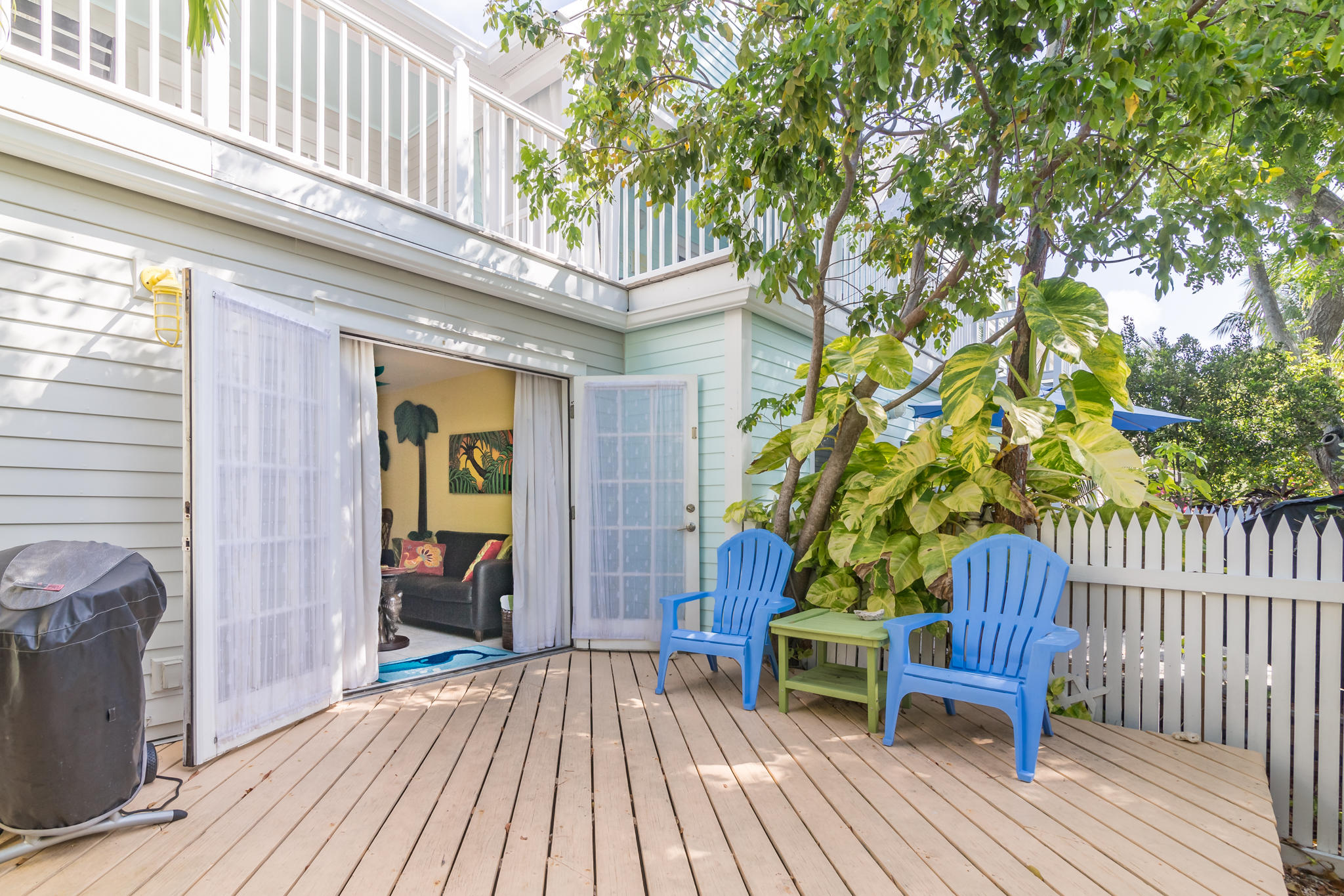 102 Southard Street, Unit 2 Key West, FL 33040 - Photo 18 of 25 a view of a house with a patio and wooden flooring