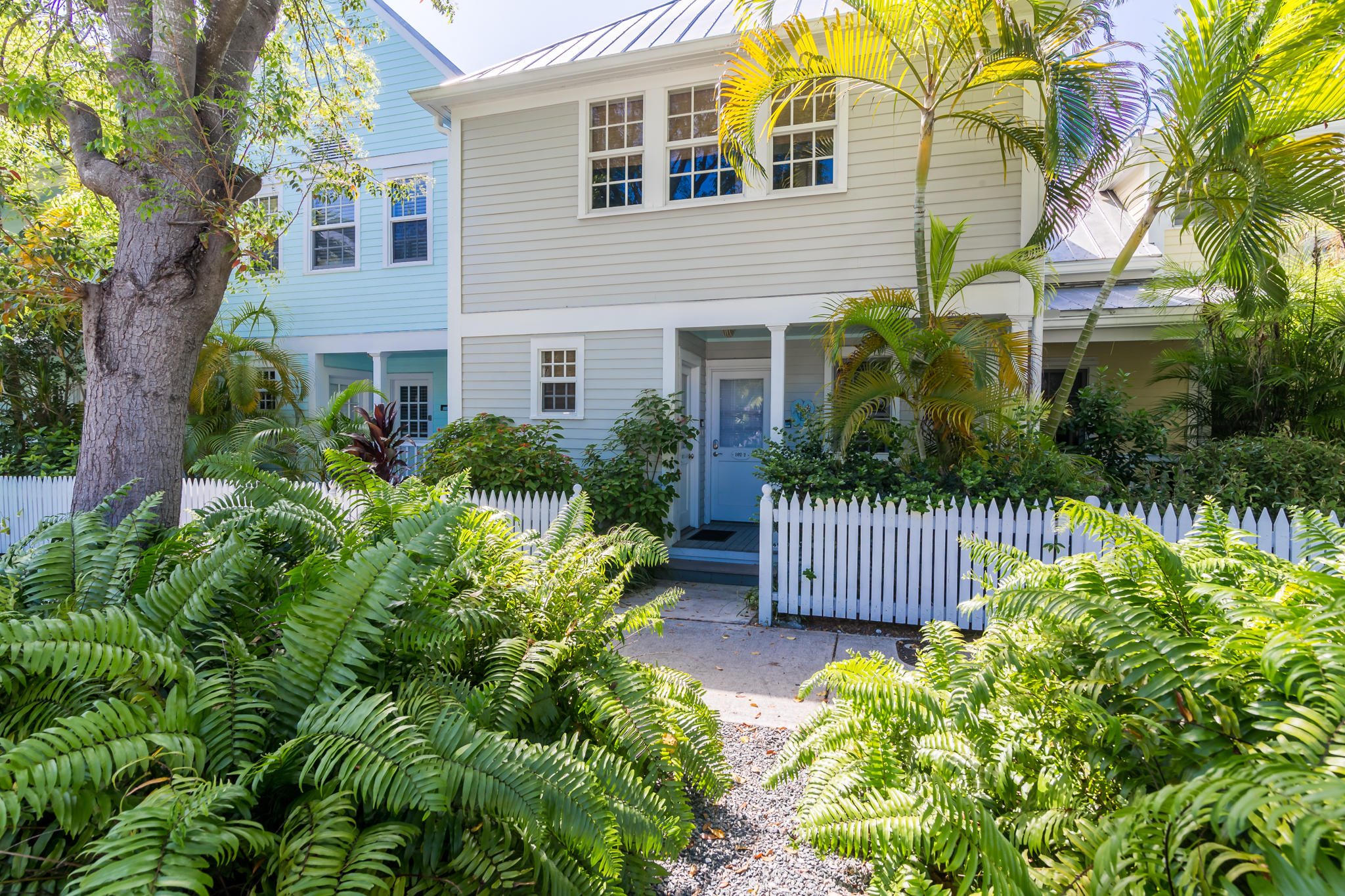 102 Southard Street, Unit 2 Key West, FL 33040 - Photo 20 of 25 a front view of a house with a garden
