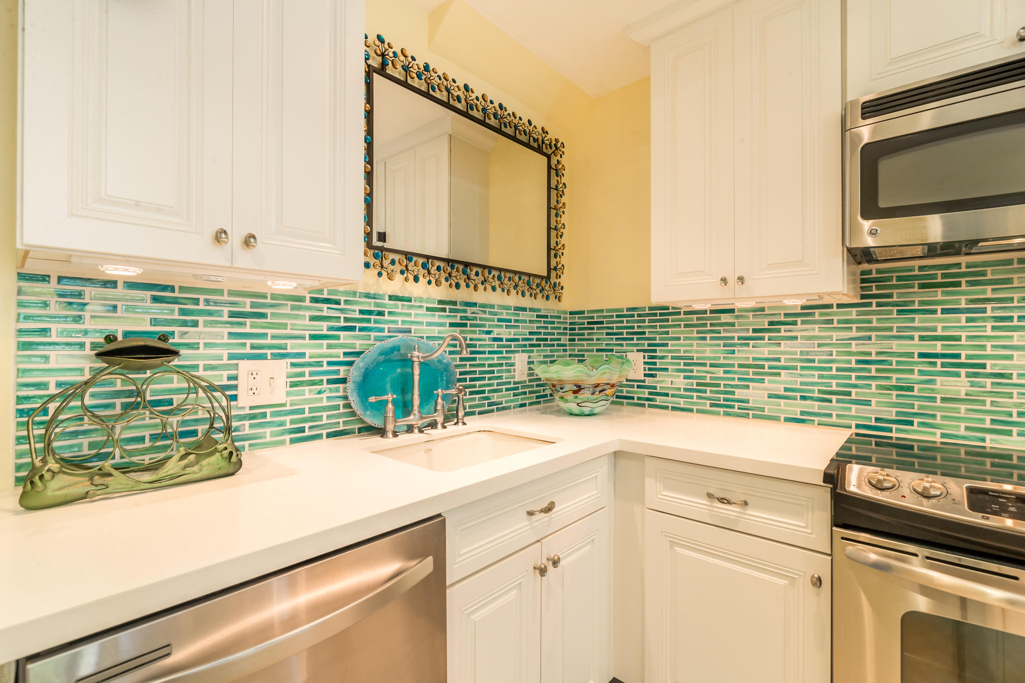 102 Southard Street, Unit 2 Key West, FL 33040 - Photo 9 of 25 a kitchen with a sink and a stove