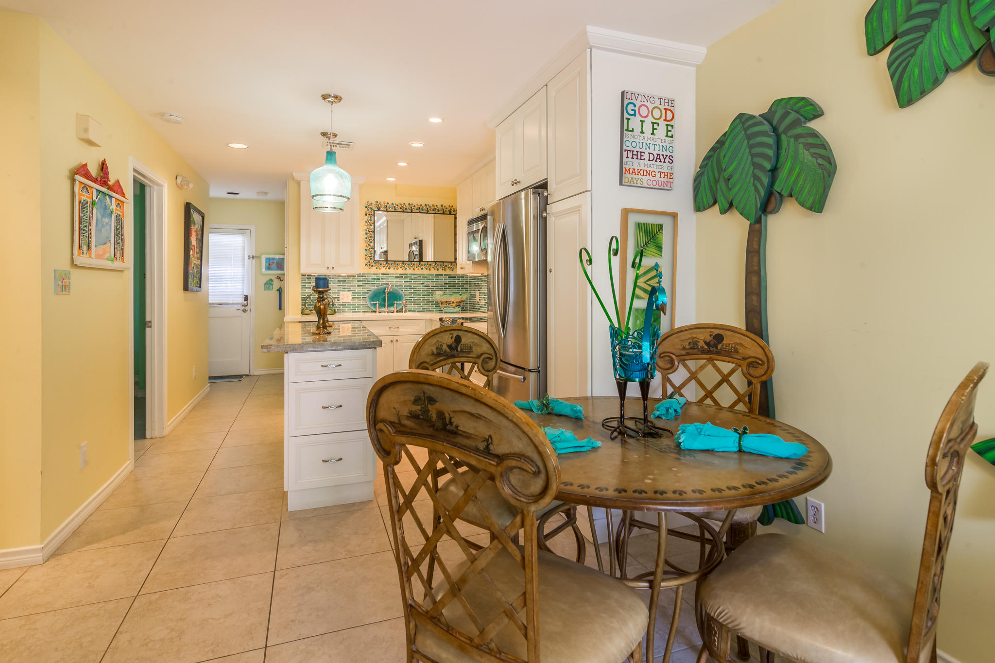 102 Southard Street, Unit 2 Key West, FL 33040 - Photo 10 of 25 a dining room filled chandelier and kitchen view