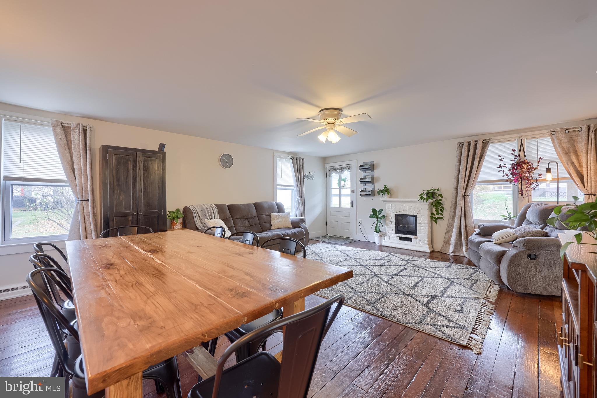 920 Chestnut Street Akron, PA 17501 - Photo 11 of 41 a open kitchen with dining table and wooden floor