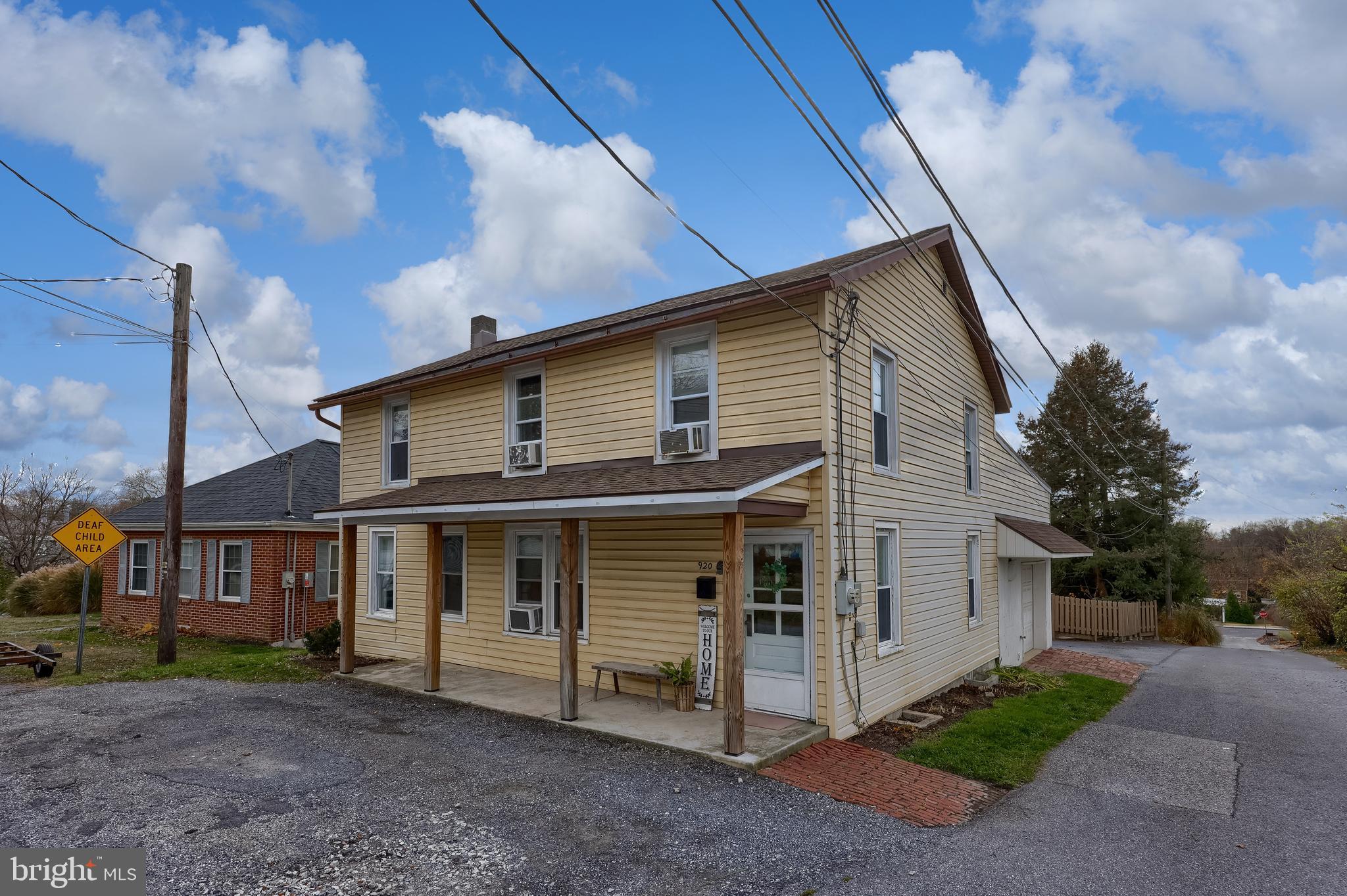 920 Chestnut Street Akron, PA 17501 - Photo 2 of 41 a view of a white house next to a yard
