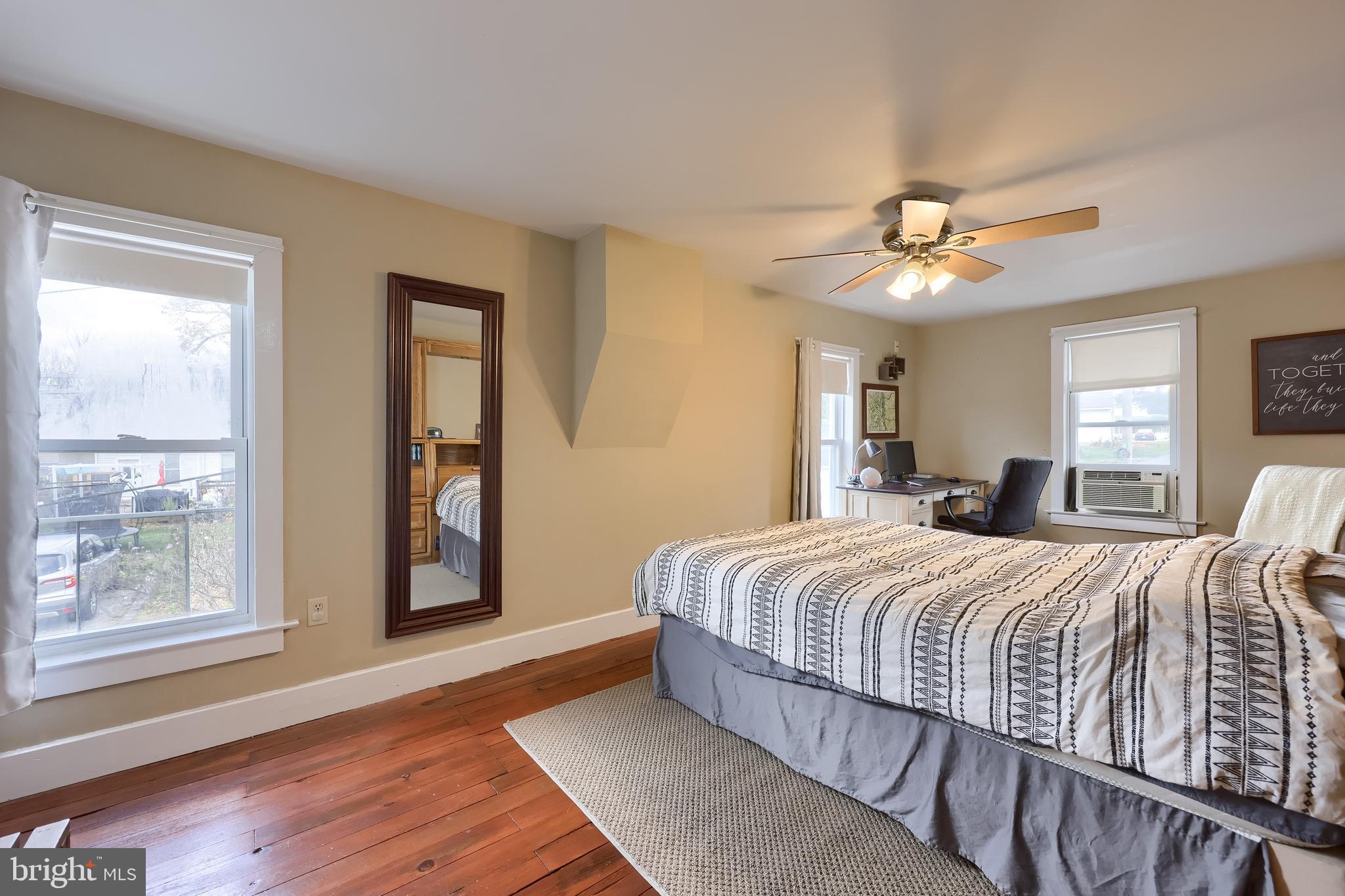920 Chestnut Street Akron, PA 17501 - Photo 27 of 41 a bedroom with a large bed a chandelier and windows