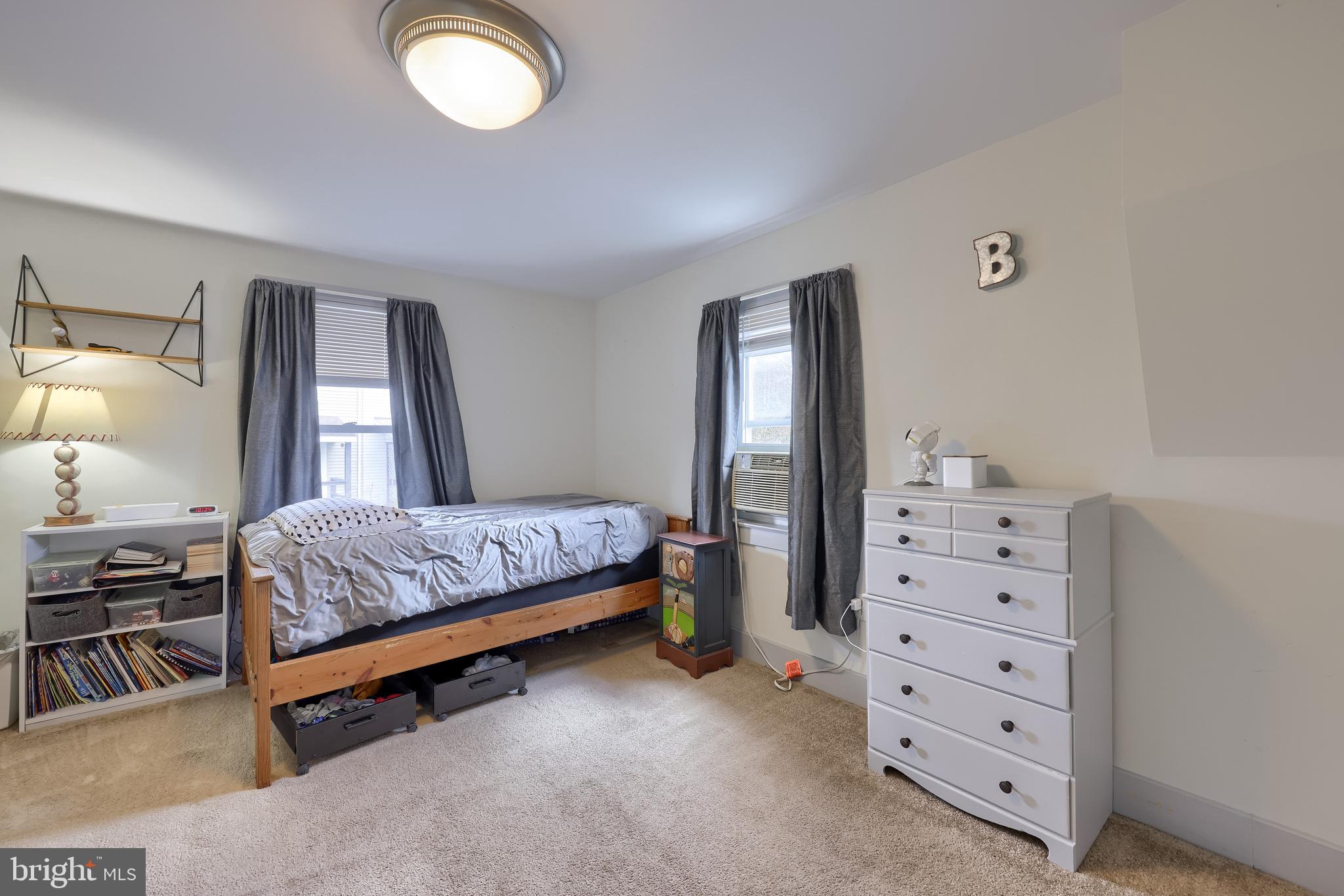 920 Chestnut Street Akron, PA 17501 - Photo 30 of 41 a bedroom with a bed and a dresser