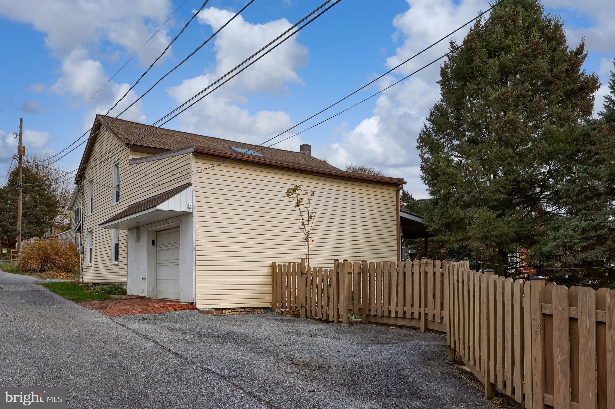 920 Chestnut Street Akron, PA 17501 - Photo 5 of 41 a view of a house with a garage