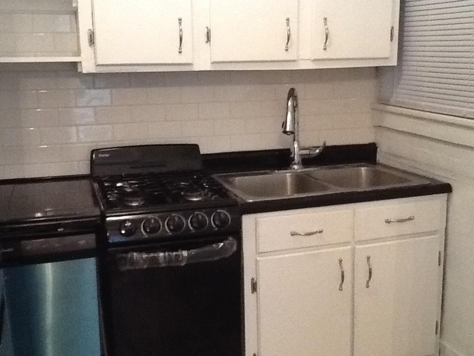 145 North Rembert Street Memphis, TN 38104 - Photo 2 of 25 a kitchen with a sink and cabinets
