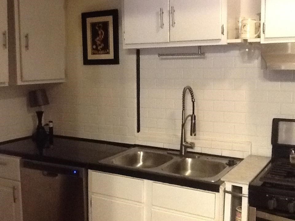 145 North Rembert Street Memphis, TN 38104 - Photo 14 of 25 a kitchen with a sink and cabinets
