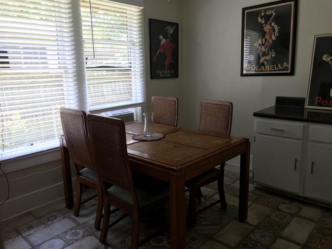 145 North Rembert Street Memphis, TN 38104 - Photo 19 of 25 a view of a dining room that has a table and a chair in it