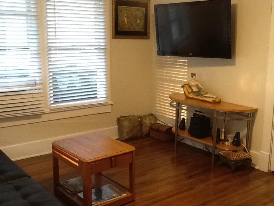 145 North Rembert Street Memphis, TN 38104 - Photo 20 of 25 a living room with furniture and a flat screen tv