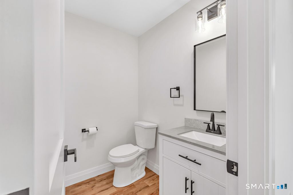 100 Tashua Road Trumbull, CT 06611 - Photo 12 of 29 a bathroom with a granite countertop toilet sink and mirror