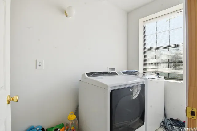 a utility room with dryer and washer