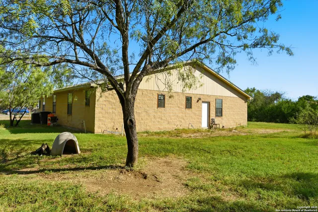 a view of a house with a yard