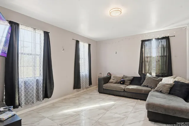 a living room with furniture and a window