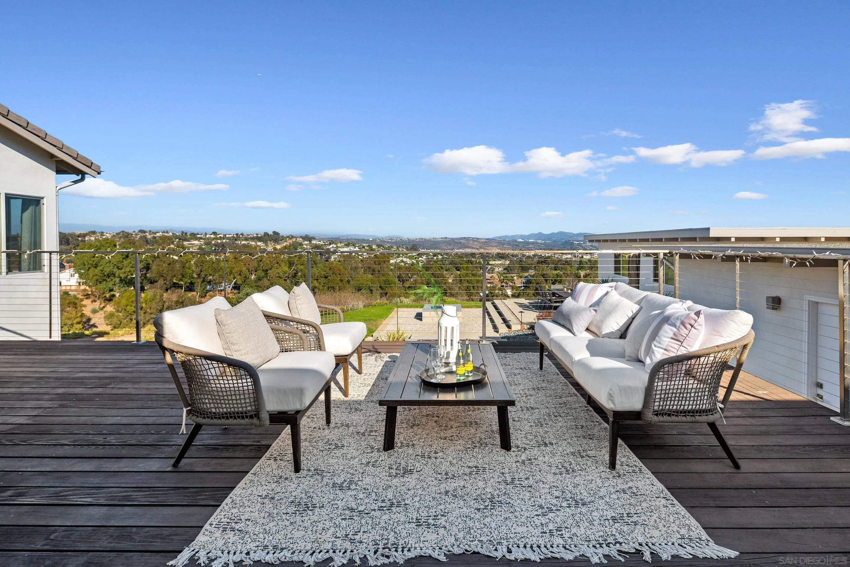 3800 Alder Avenue Carlsbad, CA 92008 - Photo 11 of 54 a roof deck with a table and chairs