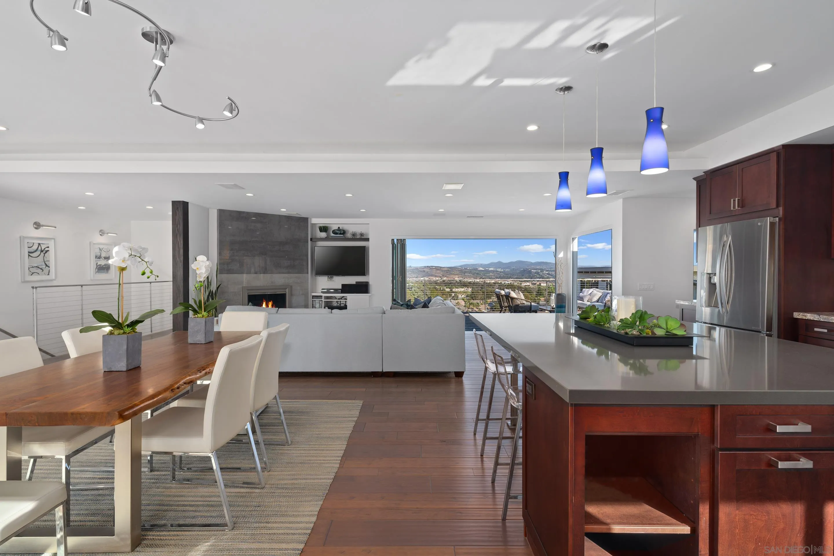3800 Alder Avenue Carlsbad, CA 92008 - Photo 15 of 54 a kitchen with stainless steel appliances kitchen island granite countertop a refrigerator and a stove top oven
