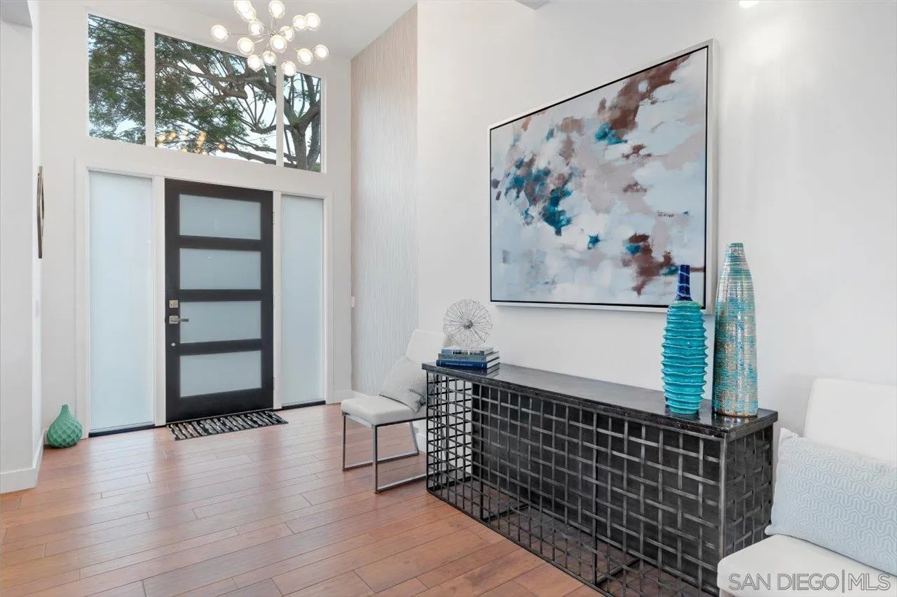 3800 Alder Avenue Carlsbad, CA 92008 - Photo 17 of 54 a view of a bedroom with wooden floor and furniture