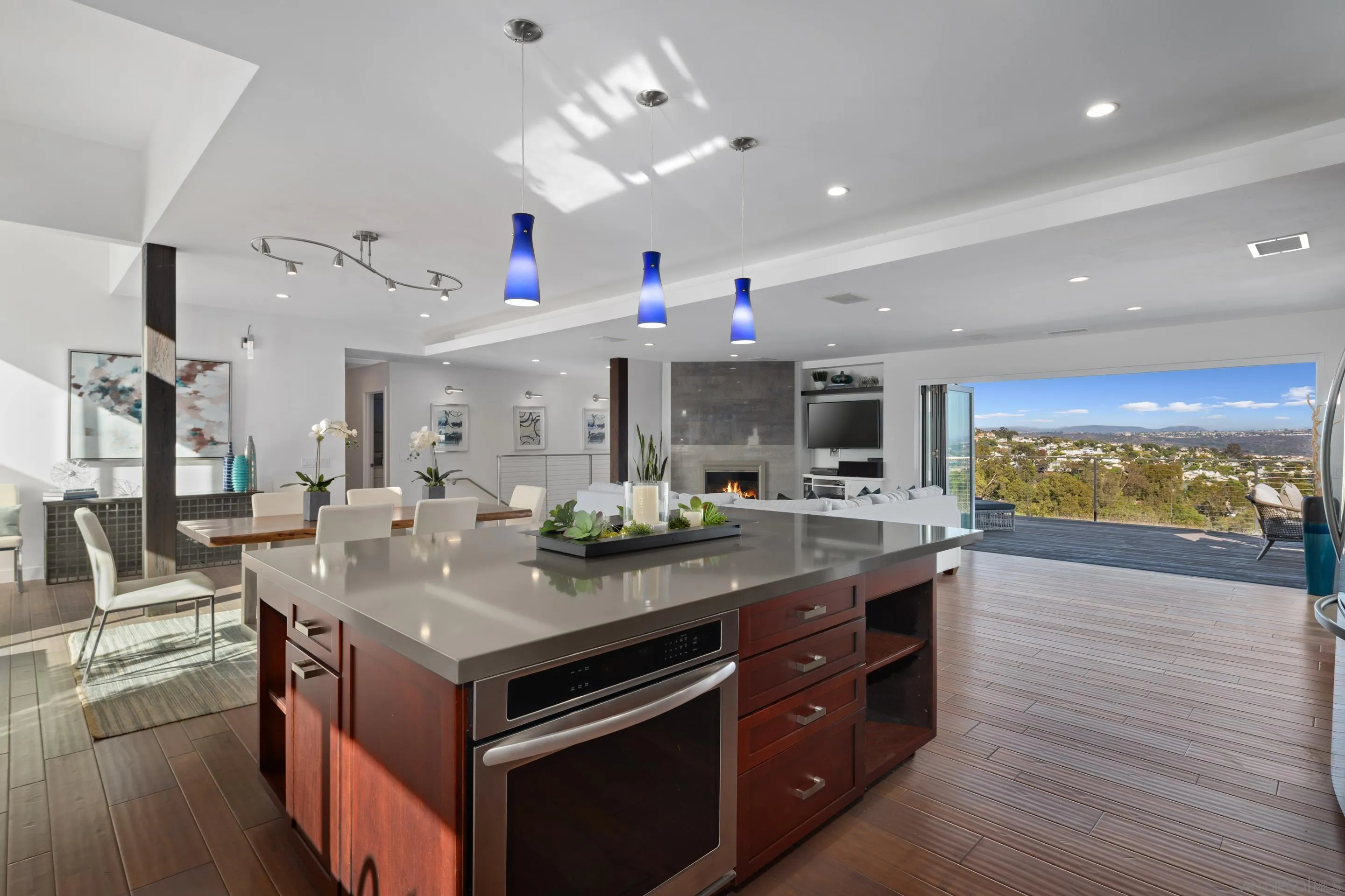 3800 Alder Avenue Carlsbad, CA 92008 - Photo 22 of 54 a kitchen with a stove and a wooden floor