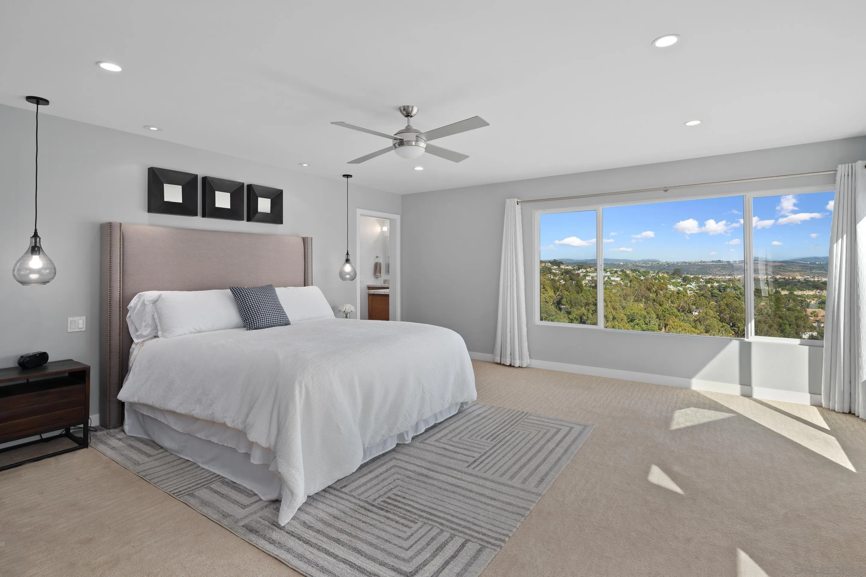 3800 Alder Avenue Carlsbad, CA 92008 - Photo 24 of 54 a bedroom with a large bed and a large window