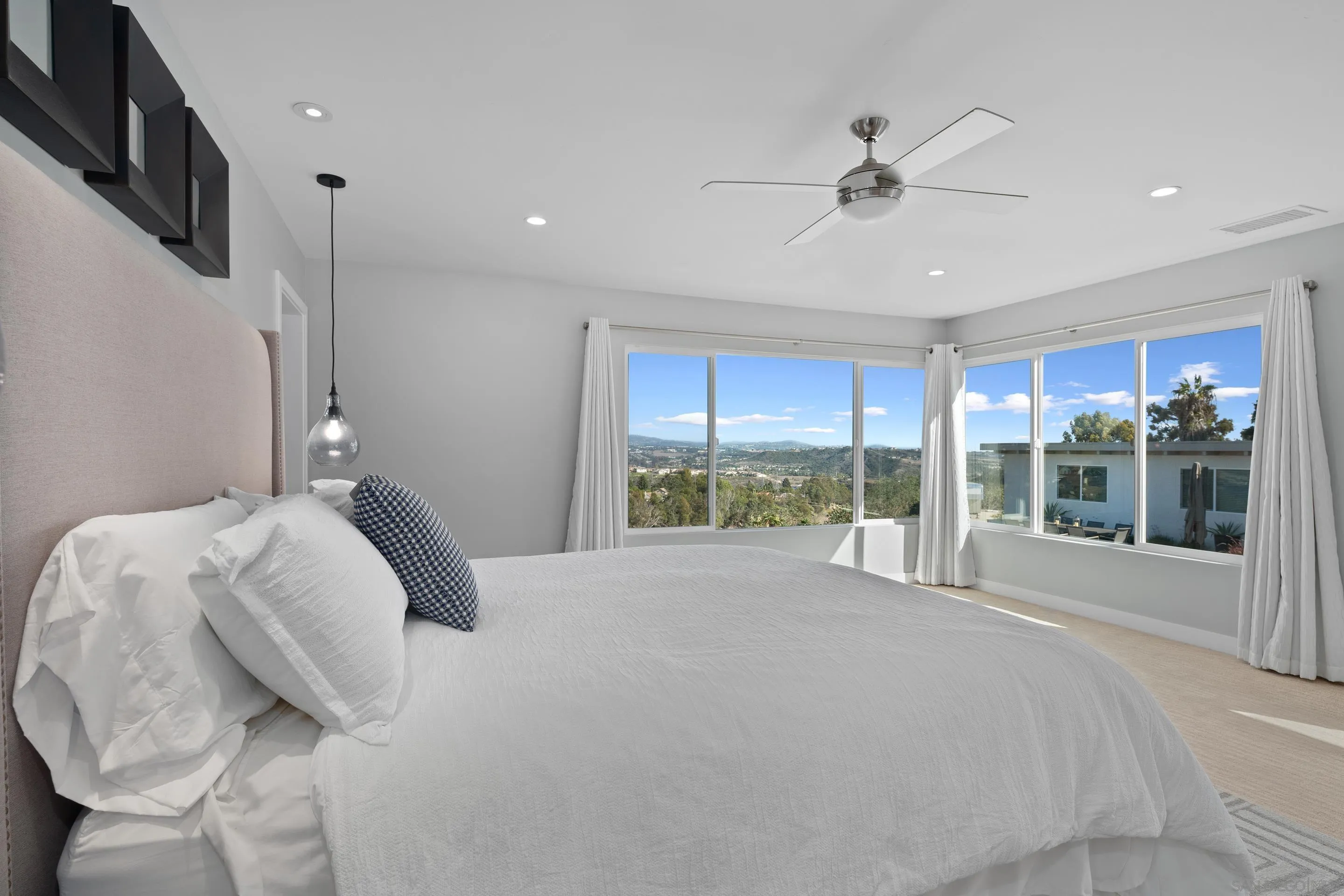 3800 Alder Avenue Carlsbad, CA 92008 - Photo 25 of 54 a bed room with a bed and a large window