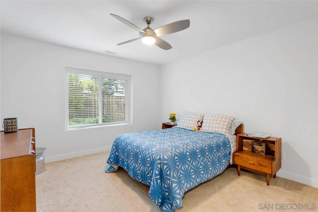 3800 Alder Avenue Carlsbad, CA 92008 - Photo 32 of 54 a bedroom with a bed and a chandelier