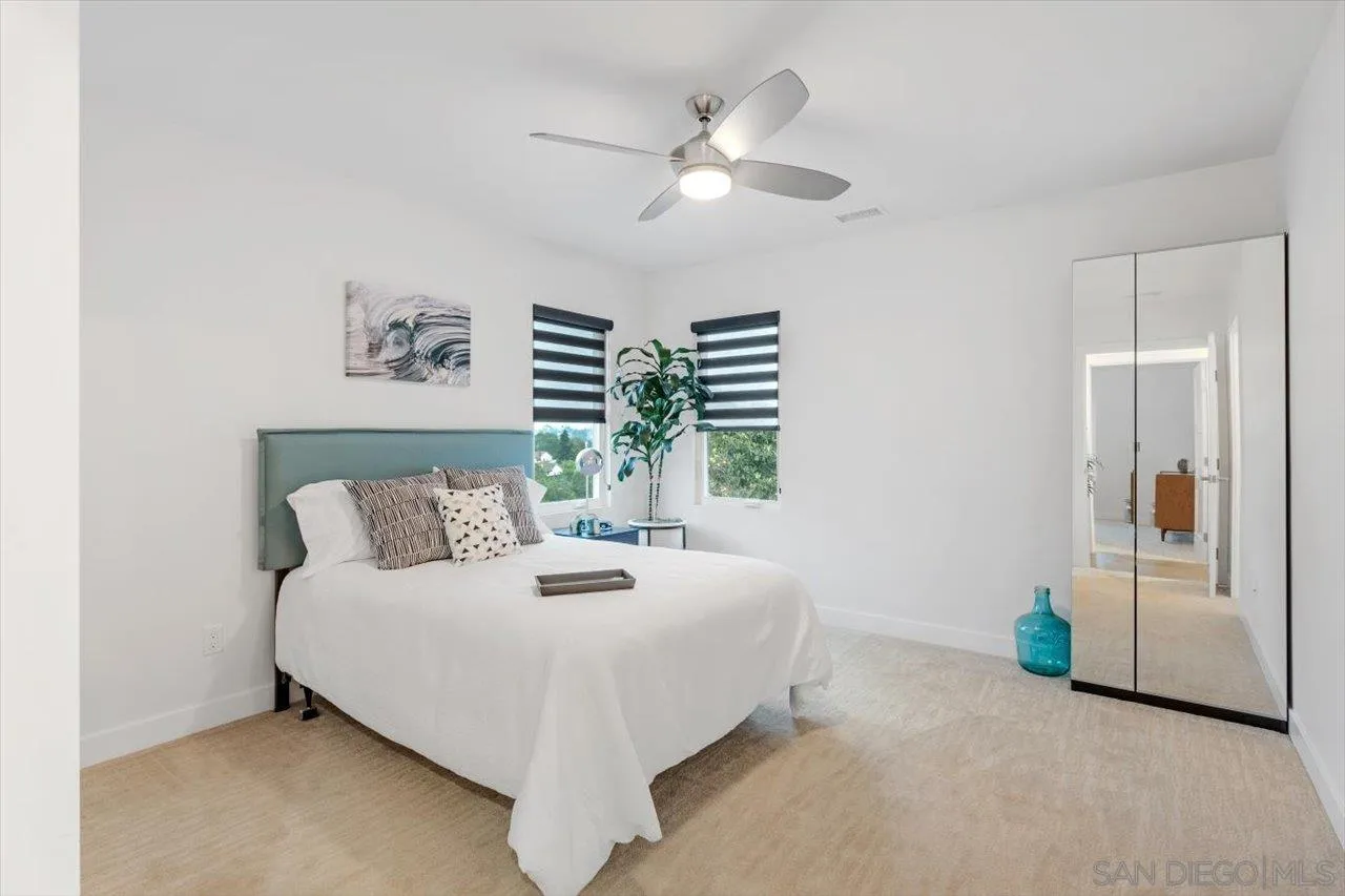 3800 Alder Avenue Carlsbad, CA 92008 - Photo 33 of 54 a bed room with a bed and a chandelier