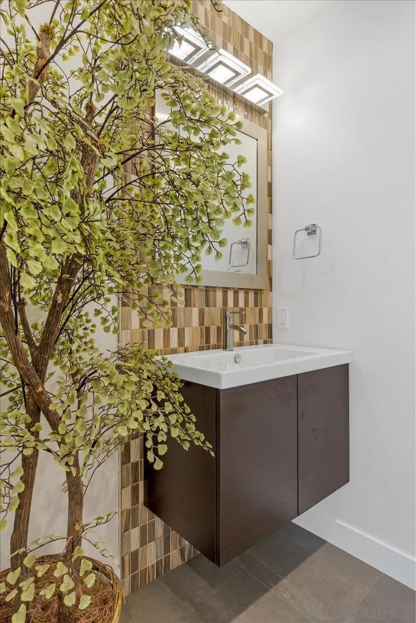 3800 Alder Avenue Carlsbad, CA 92008 - Photo 37 of 54 a bathroom with a sink and a mirror