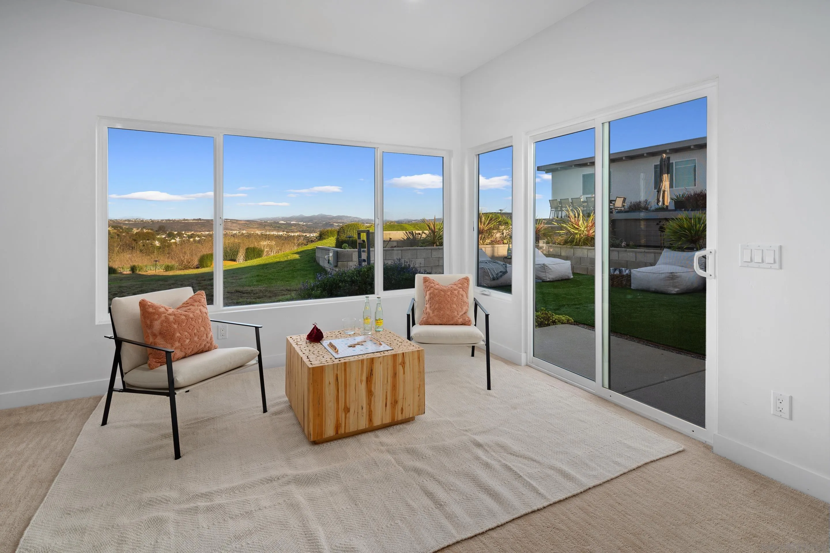3800 Alder Avenue Carlsbad, CA 92008 - Photo 38 of 54 a living room with furniture city view and large windows