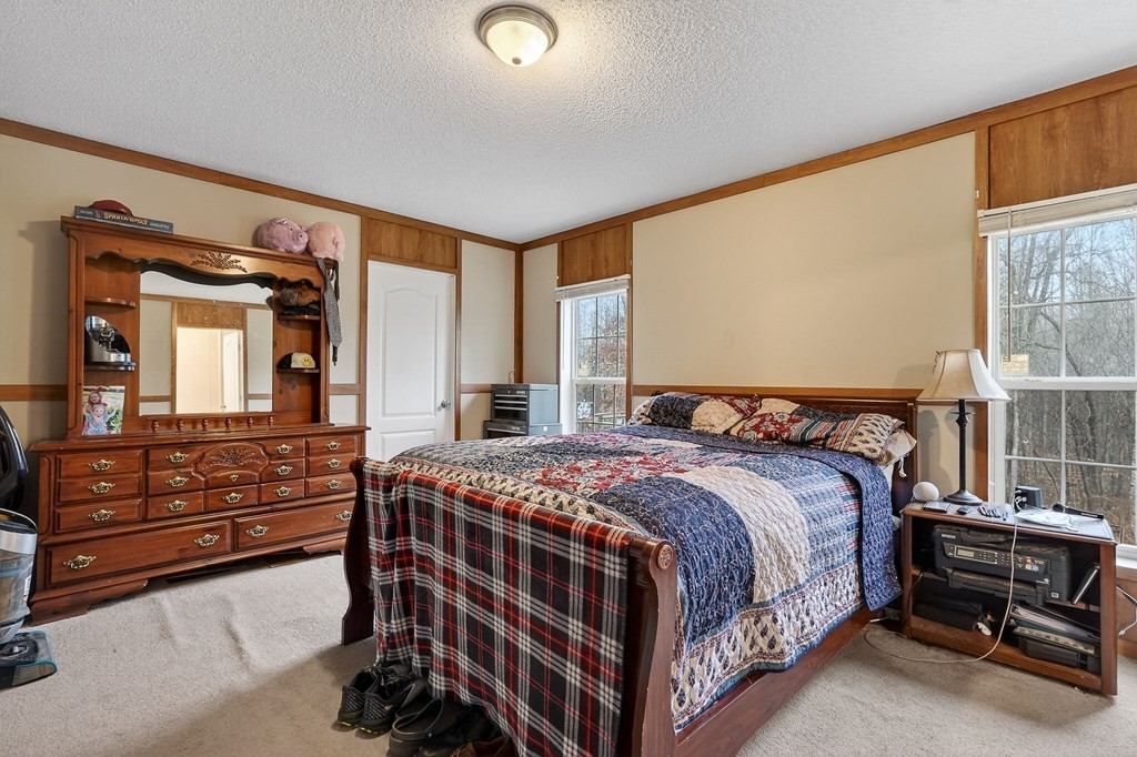 582 Doug Luna Road Walling, TN 38587 - Photo 16 of 47 a bedroom with a bed and a dresser
