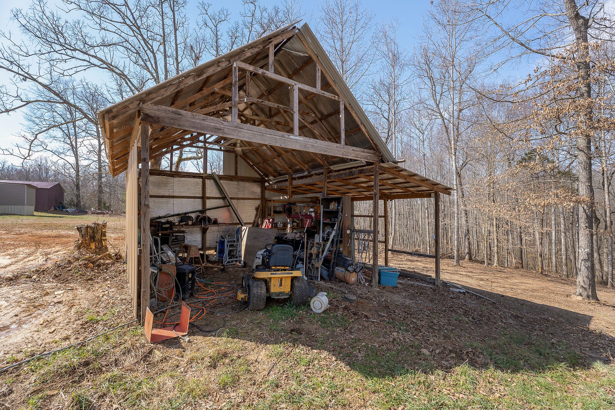 582 Doug Luna Road Walling, TN 38587 - Photo 27 of 47 a view of a wooden chairs and table in the patio