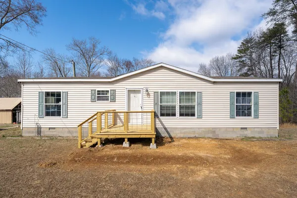 front view of a house with a chairs