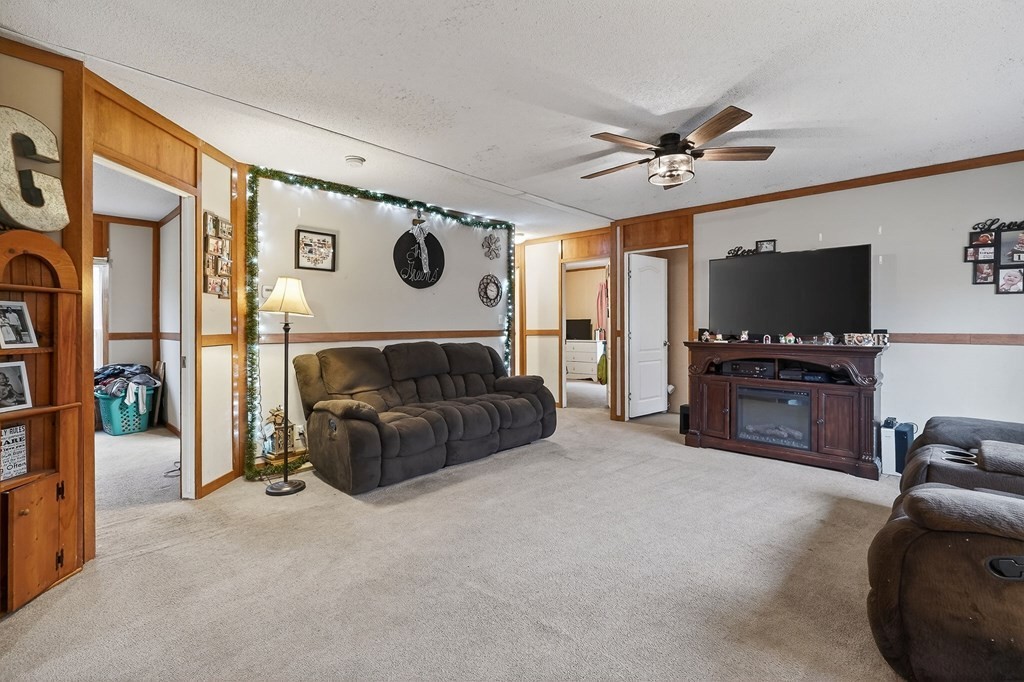582 Doug Luna Road Walling, TN 38587 - Photo 6 of 47 a living room with furniture and a flat screen tv