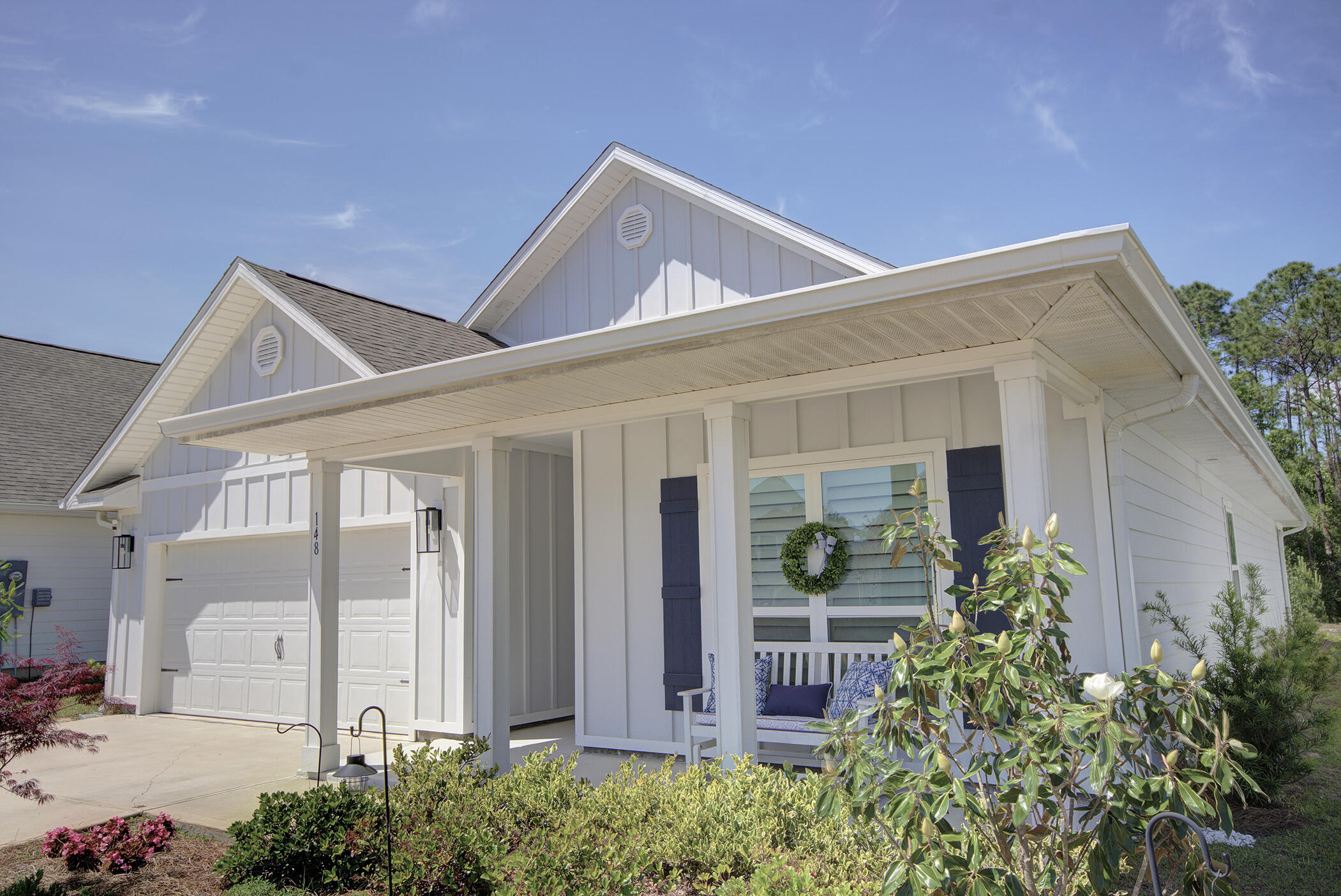 148 Piper Cove Santa Rosa Beach, FL 32459 - Photo 1 of 35 a front view of a house with garden