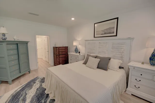 a bedroom with a bed and a television