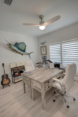 a bedroom with a bed a table and chair