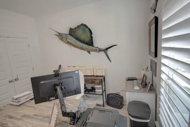 a work room with furniture and a window